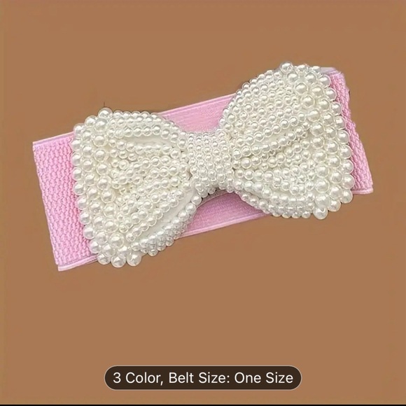An elegant solid colored elastic waistband with a wide imitation pearl bow - Picture 9 of 10
